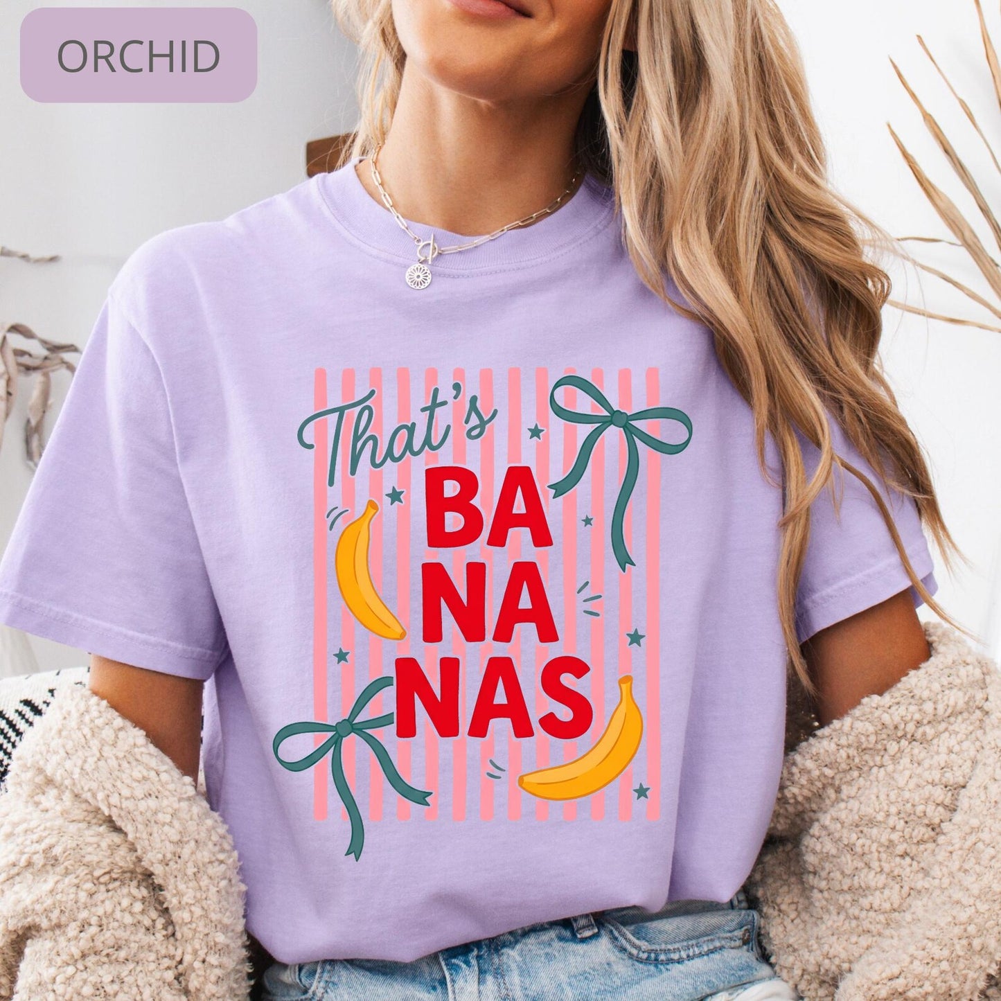 Comfort Colors 'That's Bananas' graphic tee laid flat, showing striped pattern and playful banana illustrations
