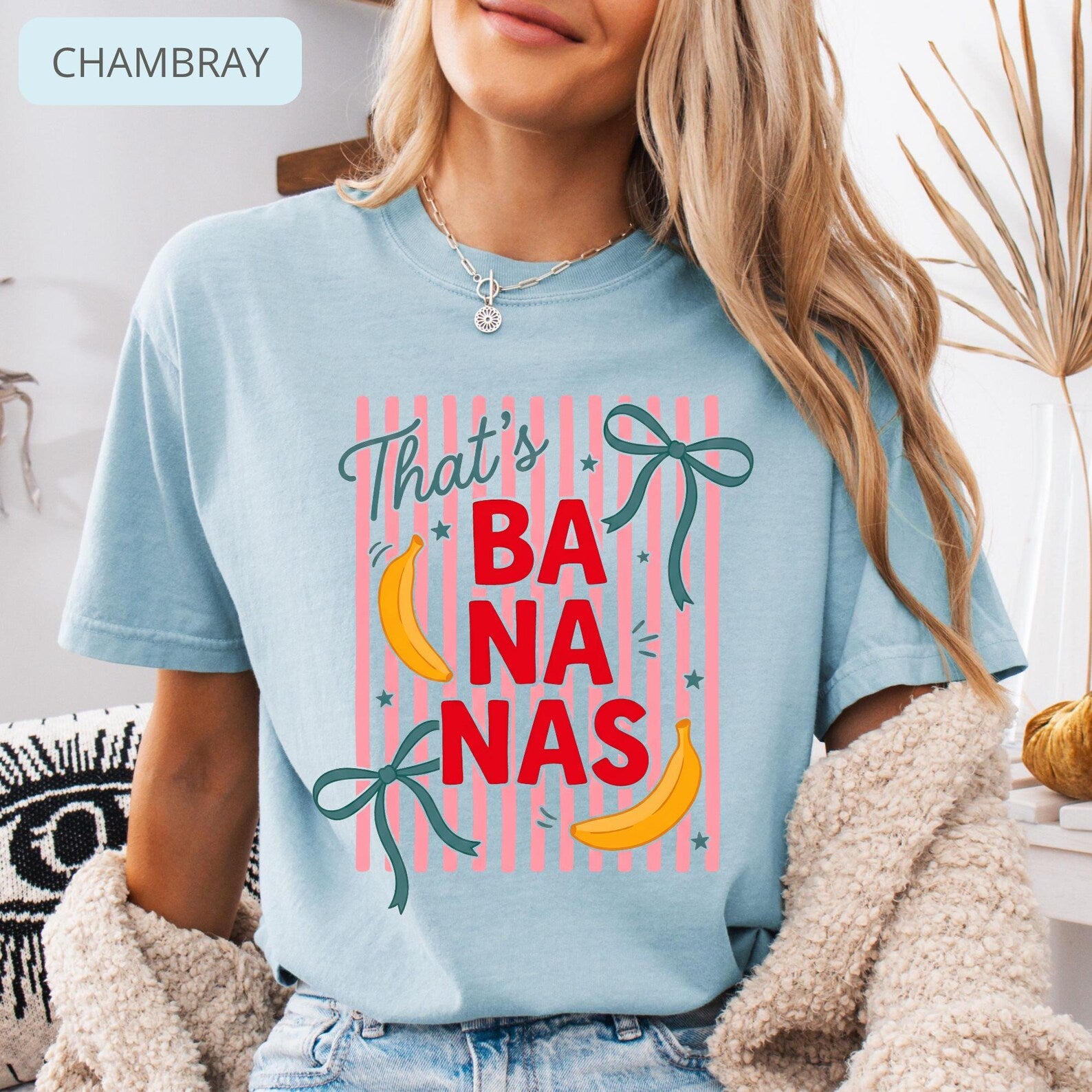 Model wearing Comfort Colors 'That's Bananas' shirt with fun striped pattern and banana illustrations, perfect for casual wear.