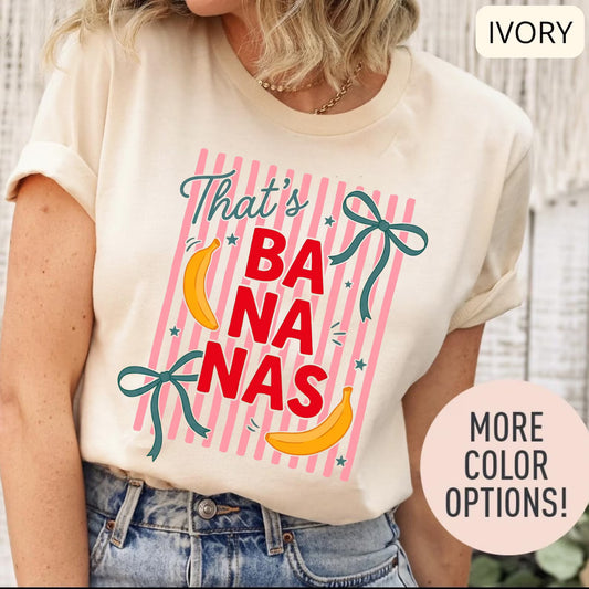 Comfort Colors 'That's Bananas' shirt with pink stripes and playful banana graphics.